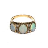A five stone opal and diamond ring in 9 carat gold