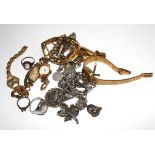 A collection of two silver charm bracelets, a cross chain, rings and six ladies wristwatches