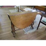 A Victorian walnut oval Sutherland table, with lyre shape supports joined by a turned stretcher,