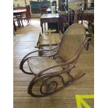 A late 19th century bentwood and cane rocking chair, in the style of Thonet