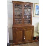 An Edwardian mahogany and satinwood crossbanded bookcase cabinet, the inlaid dentil cornice over a