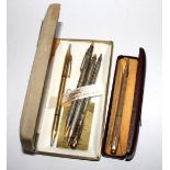 A boxed gold plated Yard-O-Led pencil, a Bradley pencil and ballpoint pen set, cased, a Garland