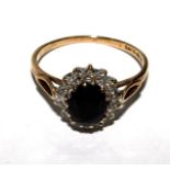 A 9 carat gold set sapphire and diamond ring