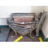 A cast iron fire basket, with brass finish acanthus scroll feet, 48 cm wide