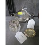 A silver plated mustard pot, a cut glass toilet jar with plated lid and a small shell shaped dish