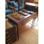 A mahogany foldover tea table, with a drop leaf to the front, covering a frieze drawer, on square