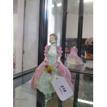 A Royal Doulton figure, Cynthia HN 1685, hand painted marks, 14 cm high (slight chips to flowers and