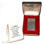 A Colibri Molectric cigarette lighter, cased (as found)