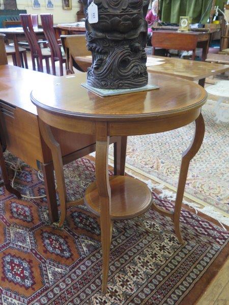 An Edwardian satinwood crossbanded mahogany circular window table, with shaped square tapering