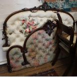 A Victorian mahogany bed head, the arched frame with foliate spray centre and button back