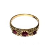 A 9 carat gold set ruby and diamond five stone ring