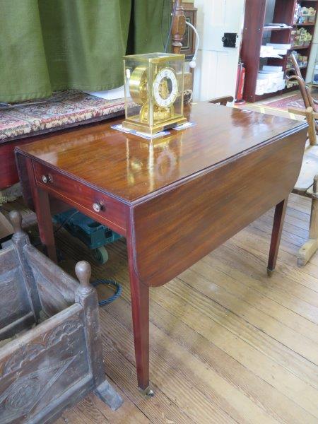 A George III mahogany Pembroke table, with boxwood strung frieze drawer on square tapering legs