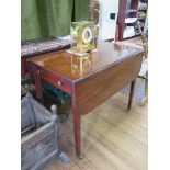 A George III mahogany Pembroke table, with boxwood strung frieze drawer on square tapering legs