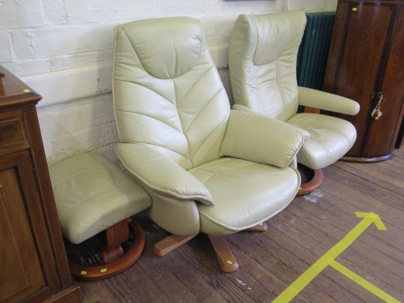 An Ekornes Stressless cream leather upholstered armchair and footstool, and another cream