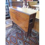 An Edwardian satinwood crossbanded mahogany Sutherland table, the canted rectangular top on rail