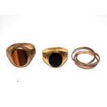 Two gem set gentleman's signet rings and a three colour gold ring