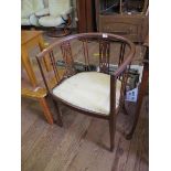 An Edwardian boxwood strung mahogany tub chair, on square section legs with spade feet