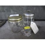 A silver and glass toilet jar, a silver plated jar and a lidded glass pill box