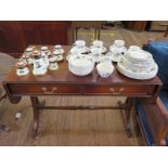 A Reprodux mahogany sofa table, with two frieze drawers on outsplayed legs joined by a pole