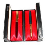 Two Parker '51' fountain pens, each in a plastic case