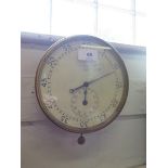 A Dent of London wall mounted timer, with brass bevel, the dial numbered 64999, 18.5cm diameter