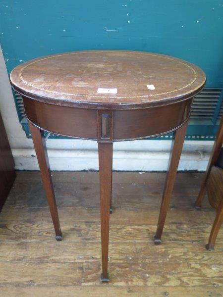 A George III style chevron banded mahogany occasional table, the oval top on square section tapering