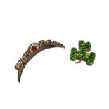 A pearl and ruby crescent brooch and clover brooch