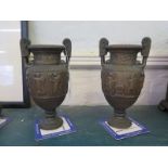 A pair of bronzed metal Classical vases, 21 cm high, and a timber mounted boot last (3)