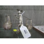 A Chinese silver cruet depicting a Chinese labourer carrying the mustard and salt on a pole across