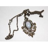 A gilt metal pendant and chain set with an opal