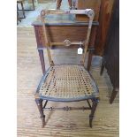 A Victorian walnut bedroom chair with cane seat