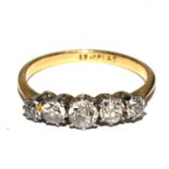 A five stone diamond ring set in 18 carat gold and platinum