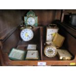 A collection of seven various clocks including Swiza, Kienzl and Marksman together with a pottery