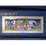 A Moorcroft Pottery plaque, depicting two outcrops at dusk, signed on the reverse and with