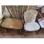 An Ercol stained ash and elm tub armchair, and a nest of tables (2)