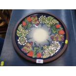 A large Moorcroft Pottery limited edition charger, in Summer Fruits design, numbered 24/25 signed by