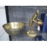 A Victorian brass figure of a man running holding a bowl, 27 cm high, and a Chinese brass bowl