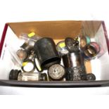 A small collection of silver plate, some silver lidded glass jars, three enamel napkin rings, a