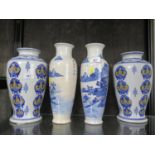 A pair of Chinese blue and white baluster vases, depicting a house in a landscape, 31 cm high, and