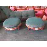 A pair of Victorian walnut oval footstools, with moulded friezes and cabriole legs, 33cm wide (2)