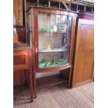 An Edwardian mahogany chequerbanded bowfront display cabinet, on square section tapering legs joined