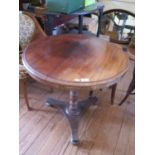 A mid Victorian mahogany window table, the circular top on a turned stem and platform base with ball