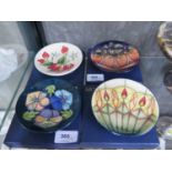 Four Moorcroft Pottery dishes, Candle Glow, Triple Choice, Brittany and New Forest, all 12 cm
