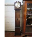 A 1930s oak miniature longcase clock, with silvered dial, the three train movement striking on