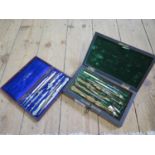 Two boxes of technical drawing instruments