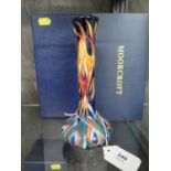 A Moorcroft Pottery elongated vase, Flames of the Phoenix design, Moorcroft Collectors Club mark,