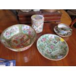 A Famille Rose punch bowl, depicting figures and butterflies, 21 cm diameter, a cylindrical lidded