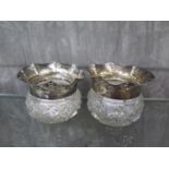 A pair of silver mounted cut glass bowls for a lady's dressing table (possible missing lids)