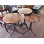 Three mahogany tripod tables, one with snap top, 51.5 cm diameter, another with reduced carved legs,