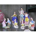 Three Continental figurines, tallest 17cm high, and four miniature Continental figurines (7)